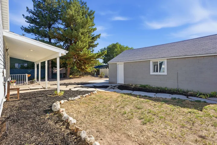 Backyard with access to the 2 car garage
