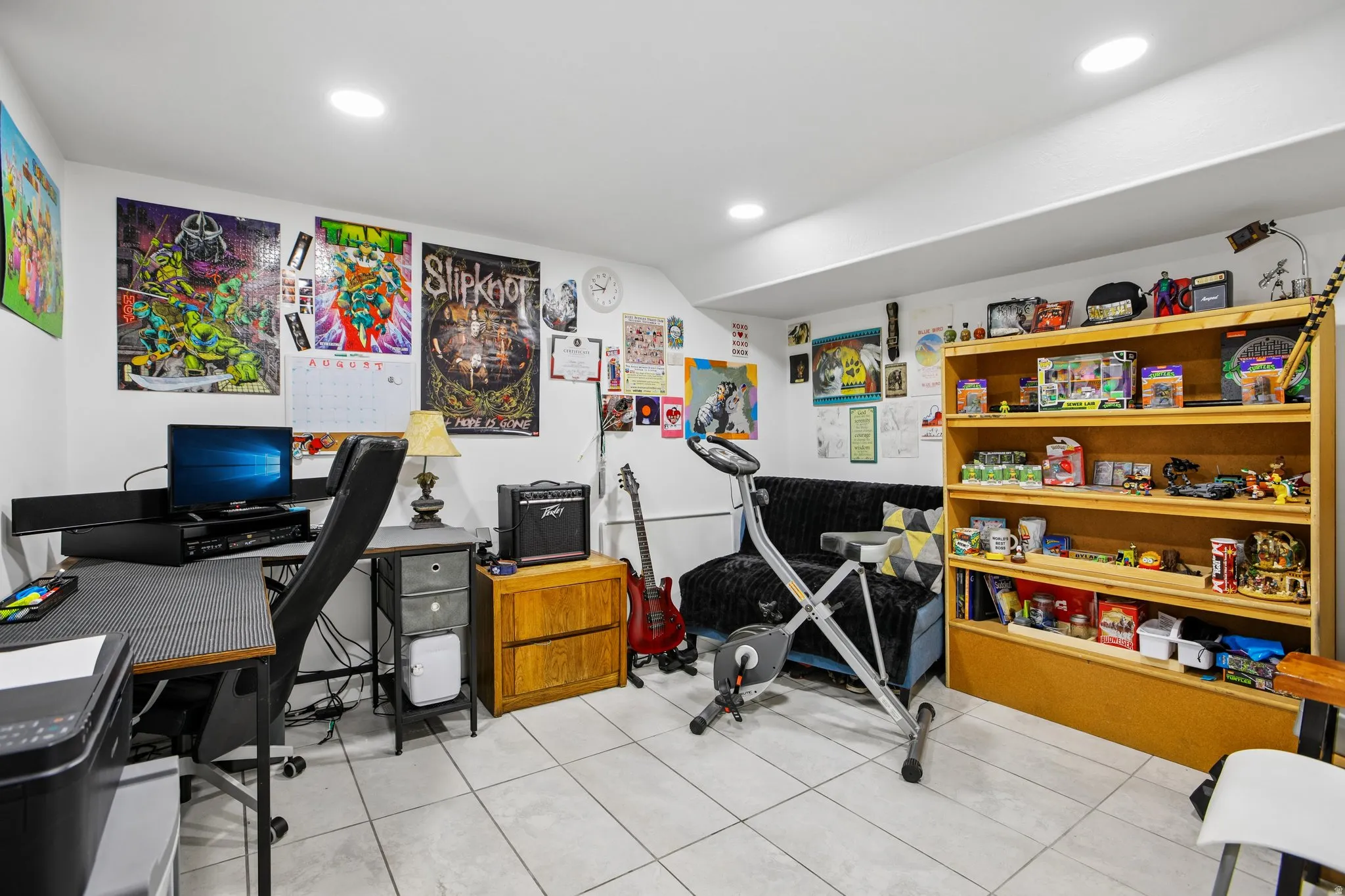 Recessed ceiling lighting illuminates tile flooring