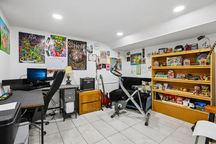 Recessed ceiling lighting illuminates tile flooring