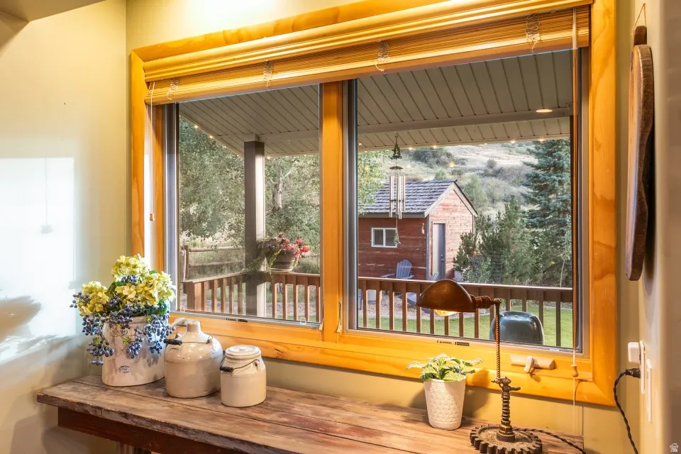 Wood-framed double-pane window with wood blinds