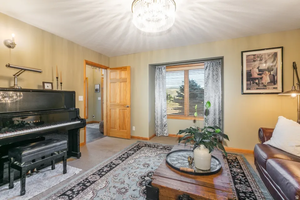 Recessed window with wood trim, wood-paneled door, and a built-in ceiling light fixture