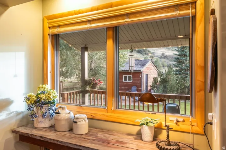 Wood-framed double-pane window with wood blinds
