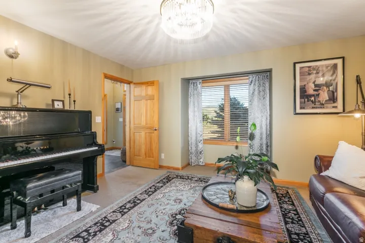 Recessed window with wood trim, wood-paneled door, and a built-in ceiling light fixture