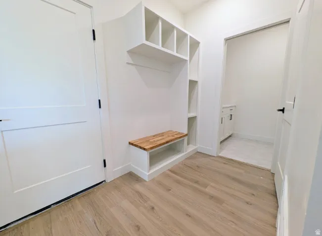 Built-in storage solutions with cubbies and a wood-finish bench
