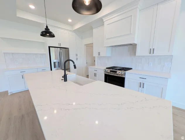 White cabinetry with dark hardware