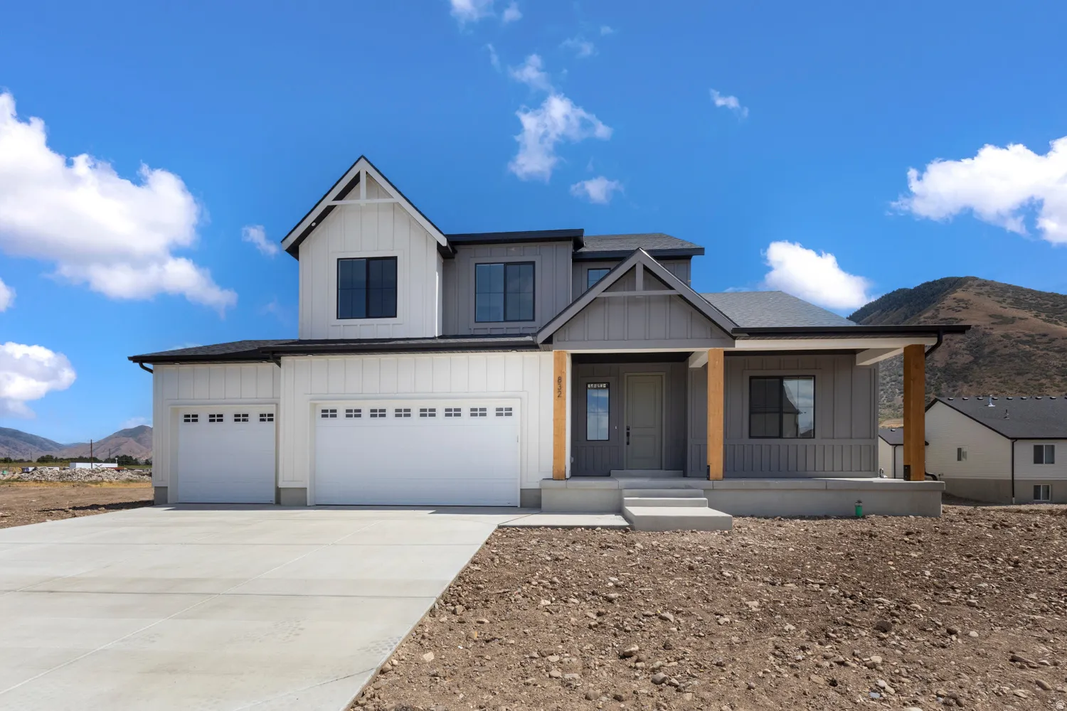 Modern farmhouse-inspired exterior with white board-and-batten siding