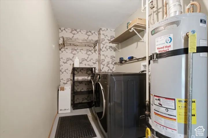 Washer/dryer area also with instant hot water heater.