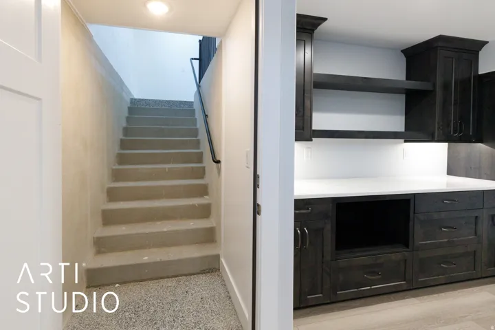Built-in cabinetry with dark wood-finish doors and drawers, open shelving, and integrated lighting
