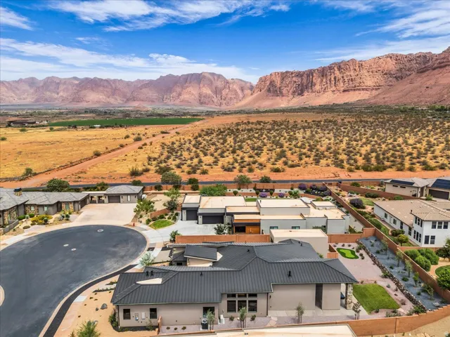 Extensive desert landscape bordering a residential development with a cul-de-sac