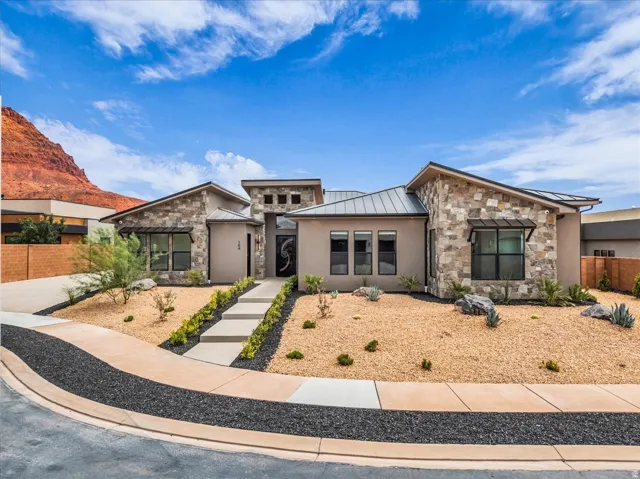 Contemporary exterior with varied stone and stucco finishes