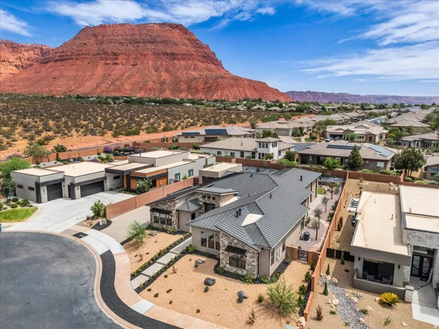 Contemporary residence with a metal roof and stone veneer accents