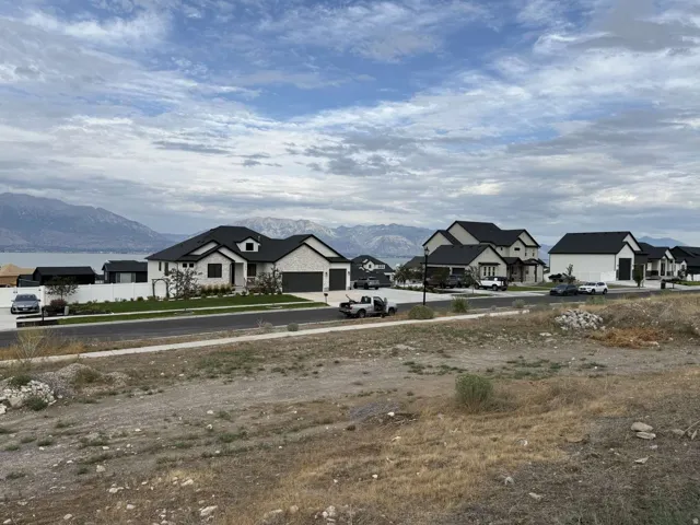 Newly constructed residential community featuring modern architectural design with varied rooflines, two-car garages, and contemporary exterior finishes