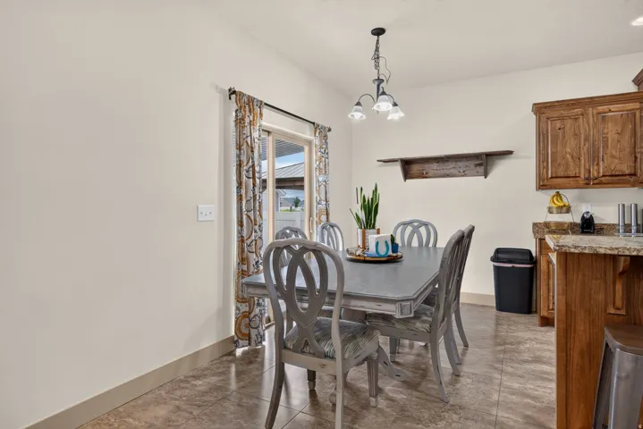 Built-in wooden cabinetry, recessed lighting, and a sliding glass door