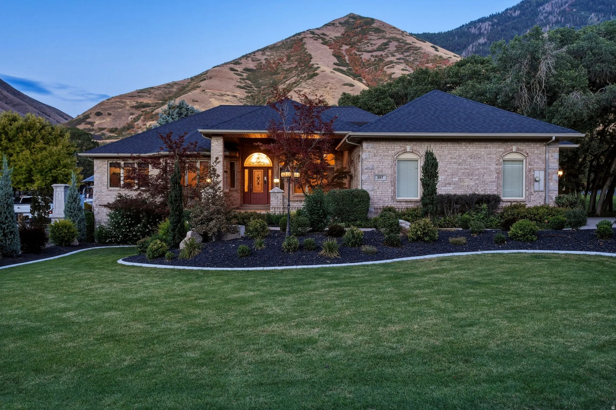Brick exterior with dark roof and arched entry