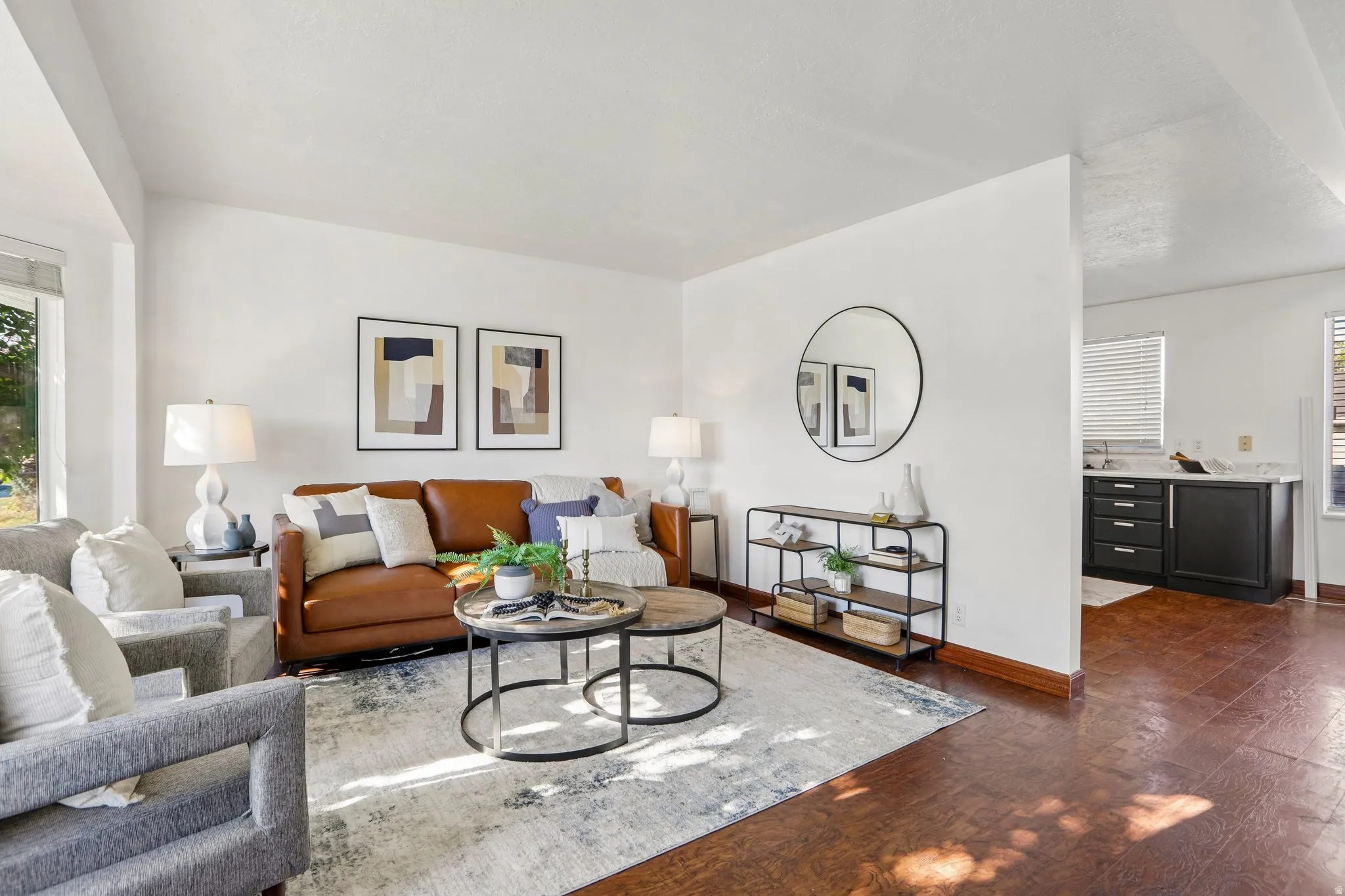Bright living area featuring wood-finish flooring and a large window