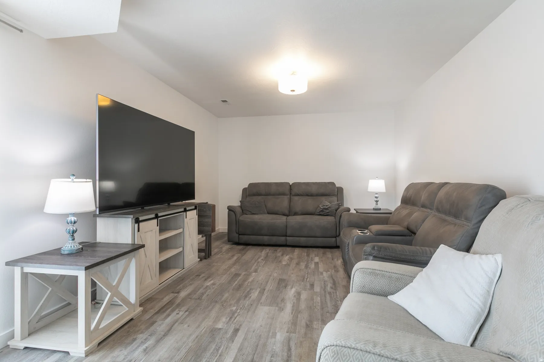 Bright interior space with light-toned walls and wood-finish flooring