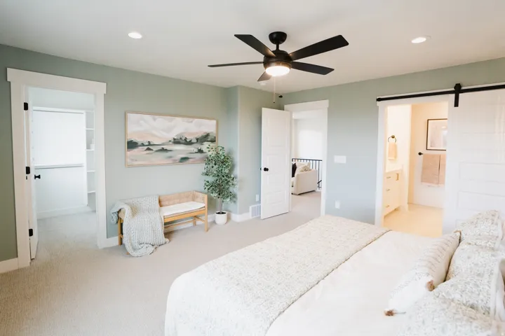Recessed lighting, ceiling fan, and carpeted flooring