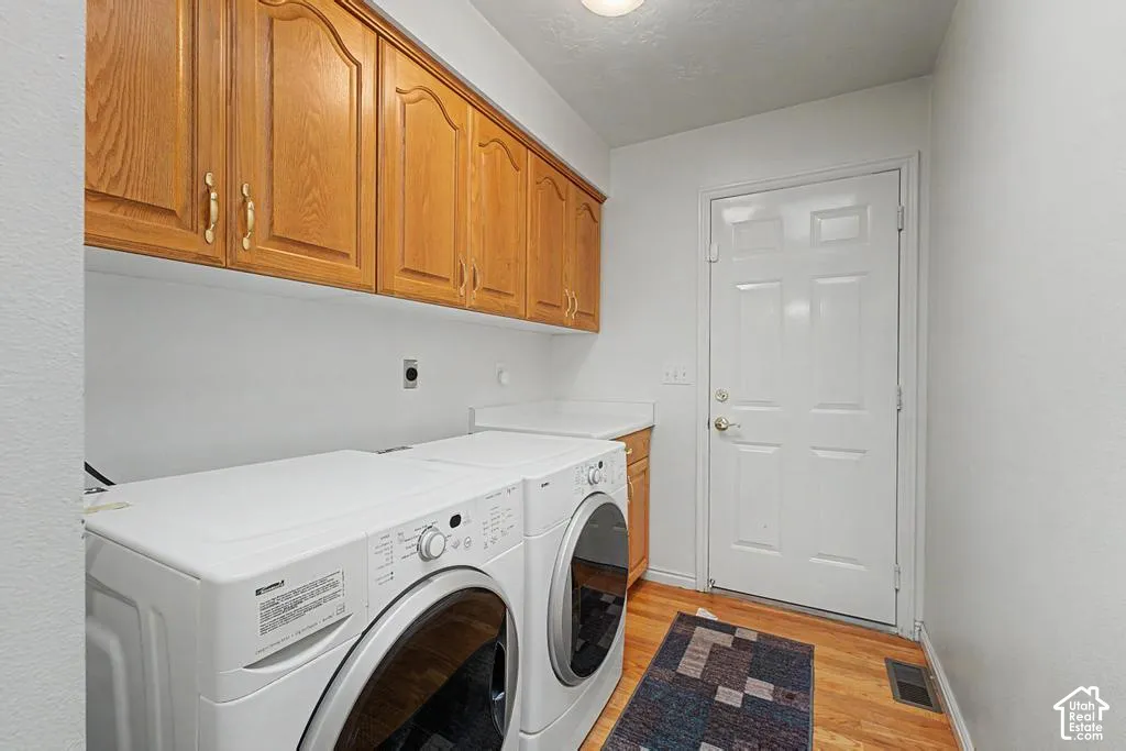 Upper wood-finish cabinetry provides storage.