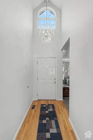 Front entry with vaulted ceilings and ample lighting.
