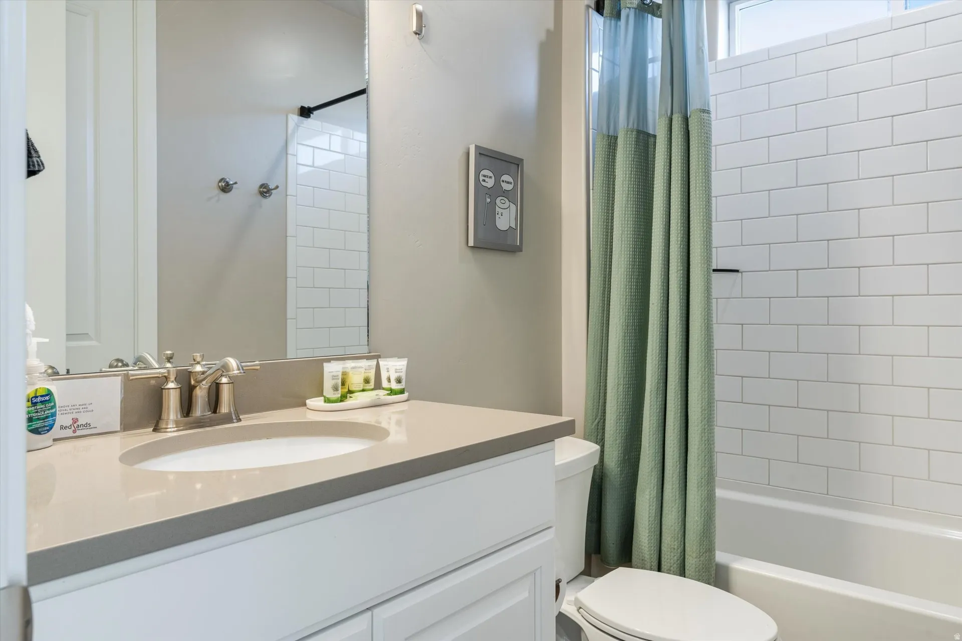 White subway tile shower surround with a built-in tub
