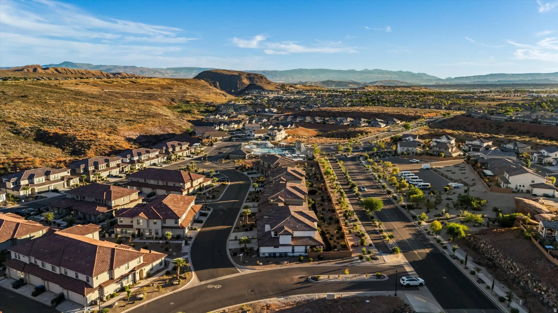 Newly developed community featuring uniform architecture and desert landscaping