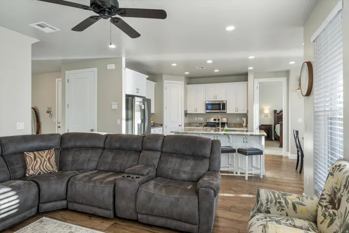 Open concept living area with wood-finish flooring
