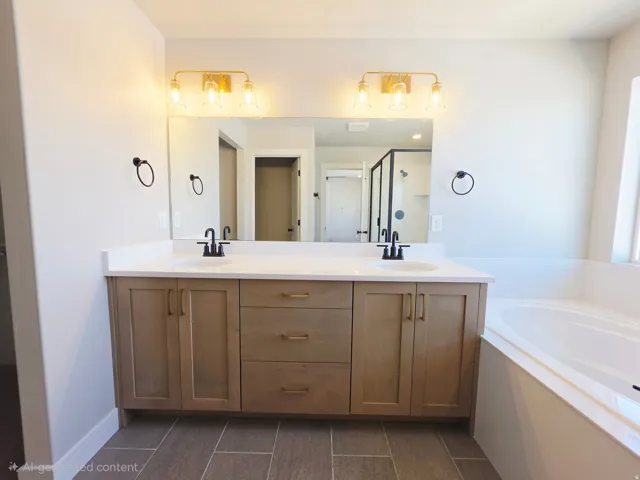Dual vanity with undermount sinks and matte black fixtures