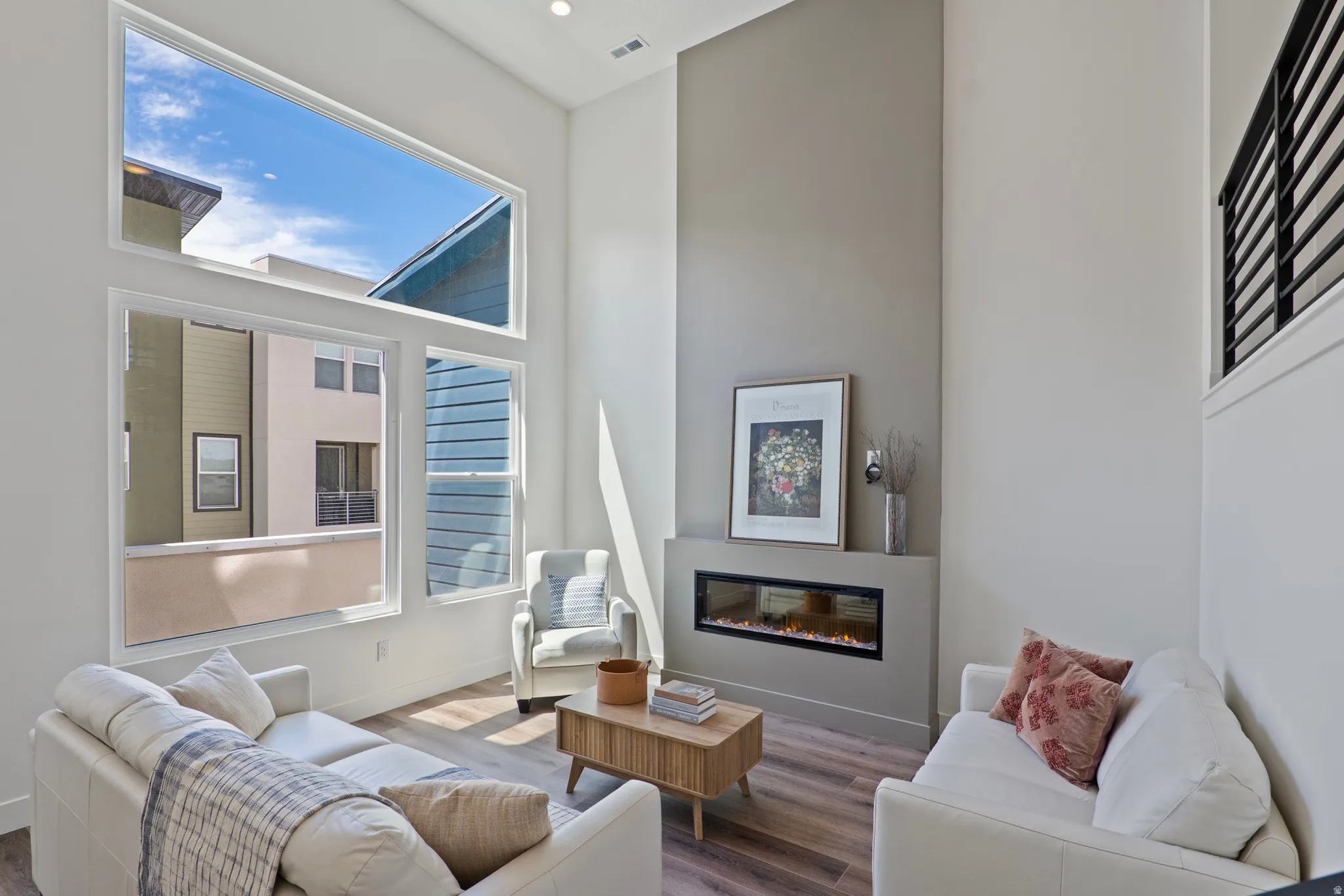 Double-height ceilings complement the expansive wall of windows