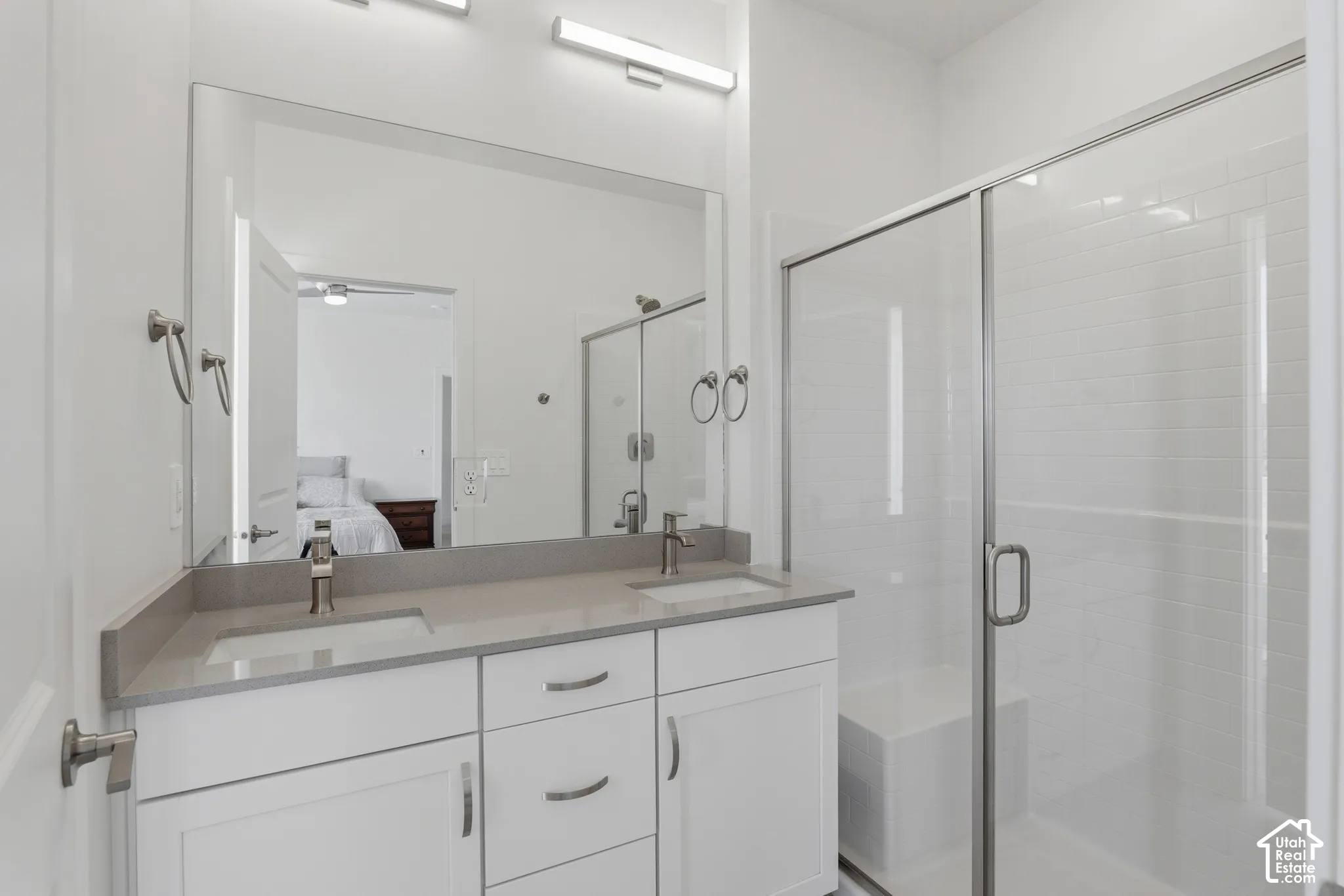 Dual vanity with integrated sinks and a stone-finish countertop
