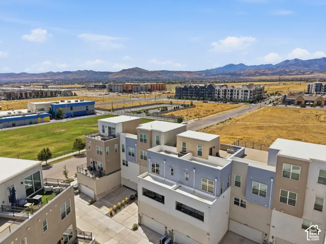 Contemporary townhome architecture featuring multiple levels, private balconies, and rooftop decks