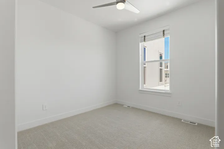 Recessed lighting, ceiling fan, and window with blinds