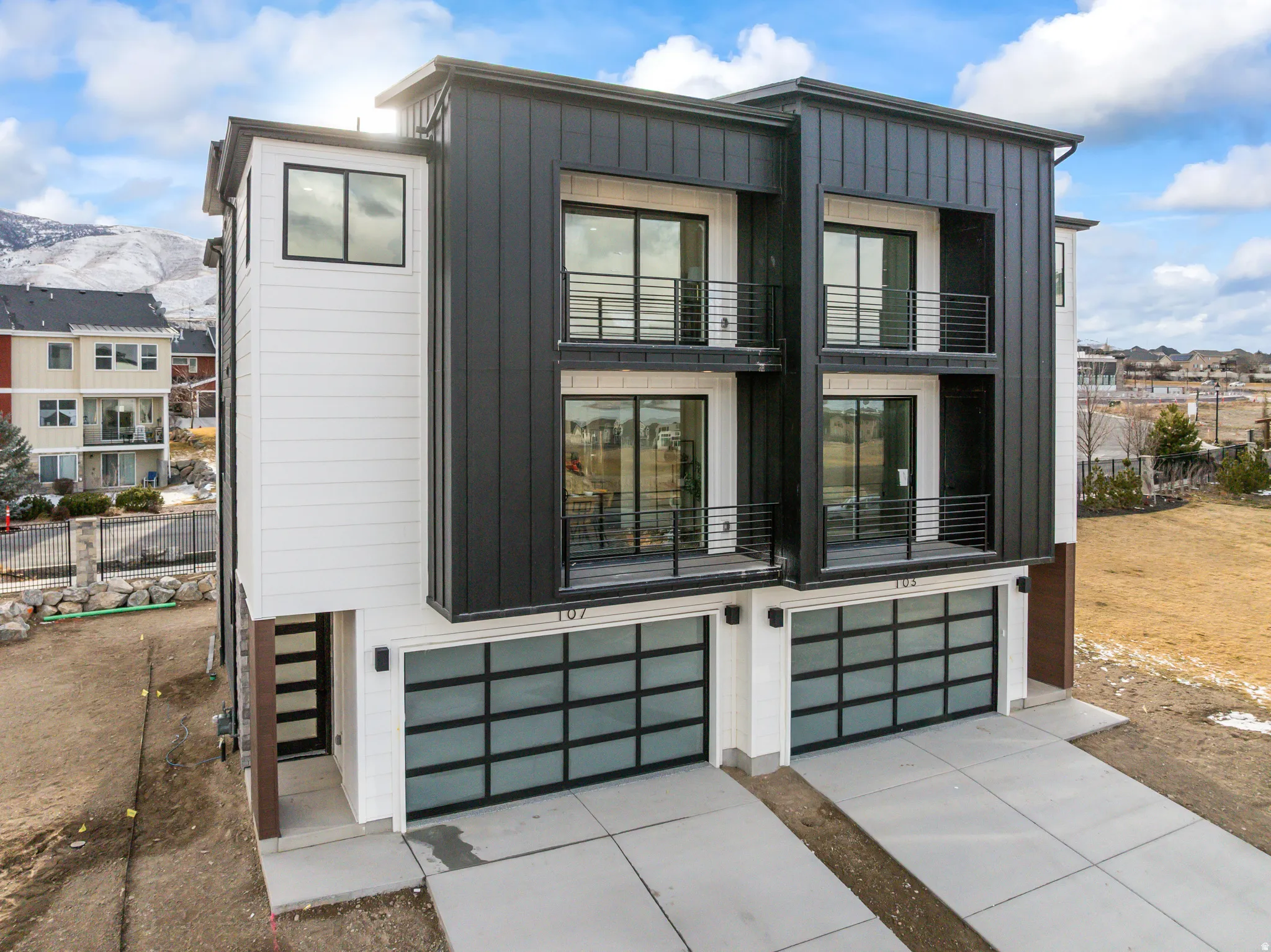 Modern exterior featuring vertical black siding and white horizontal siding