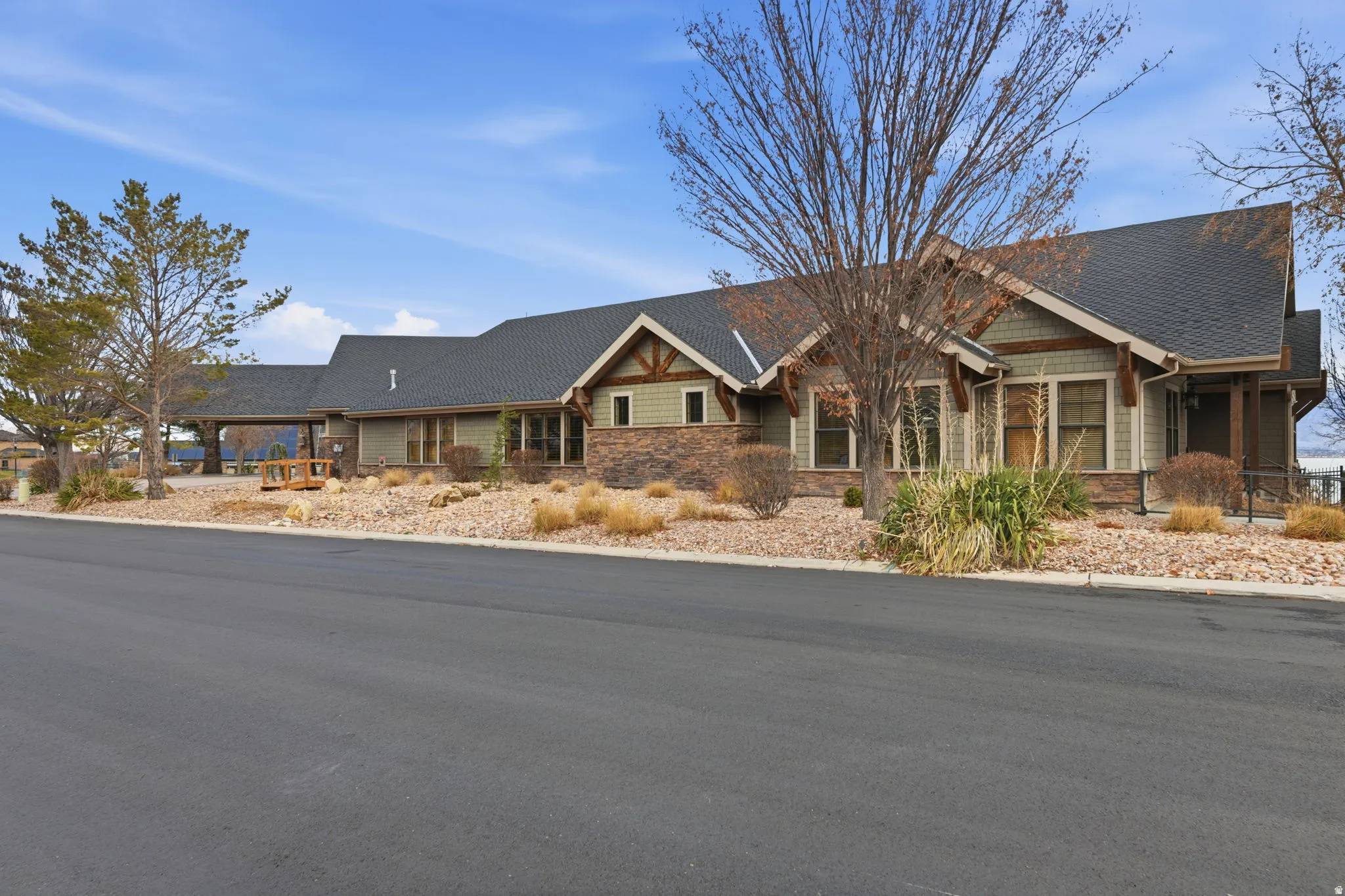 Craftsman-style exterior with wood trim accents and stone detailing