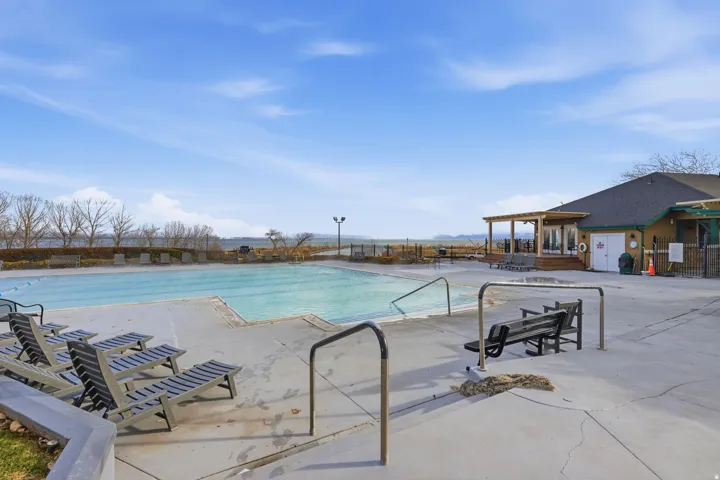 Outdoor swimming pool with integrated lane lines and concrete decking
