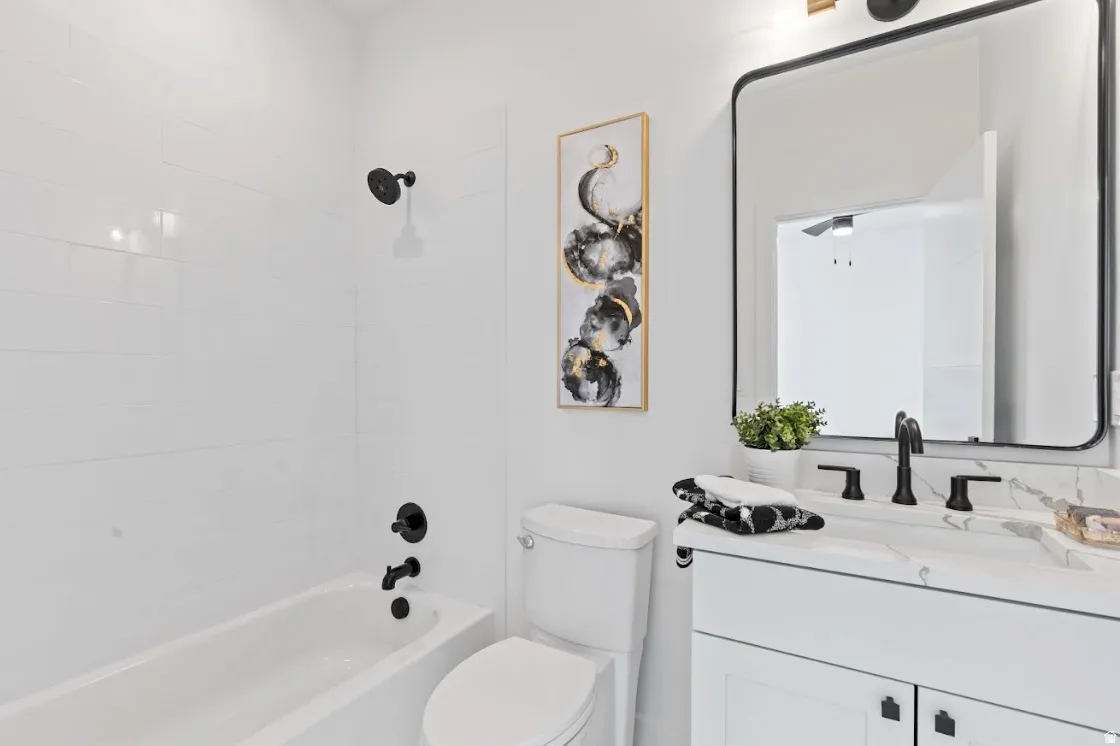 White subway tile shower surround with matte black fixtures