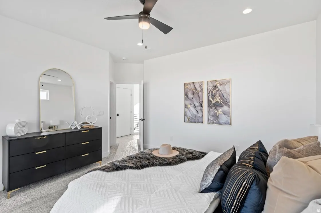 Recessed lighting, ceiling fan, and carpeted flooring