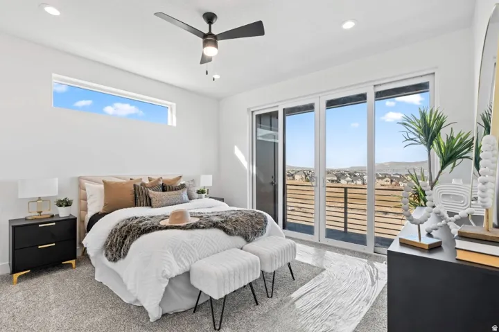 Sliding glass door, transom window, recessed lighting, ceiling fan, and carpeted flooring