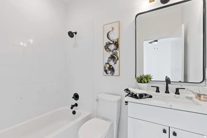 White subway tile shower surround with matte black fixtures
