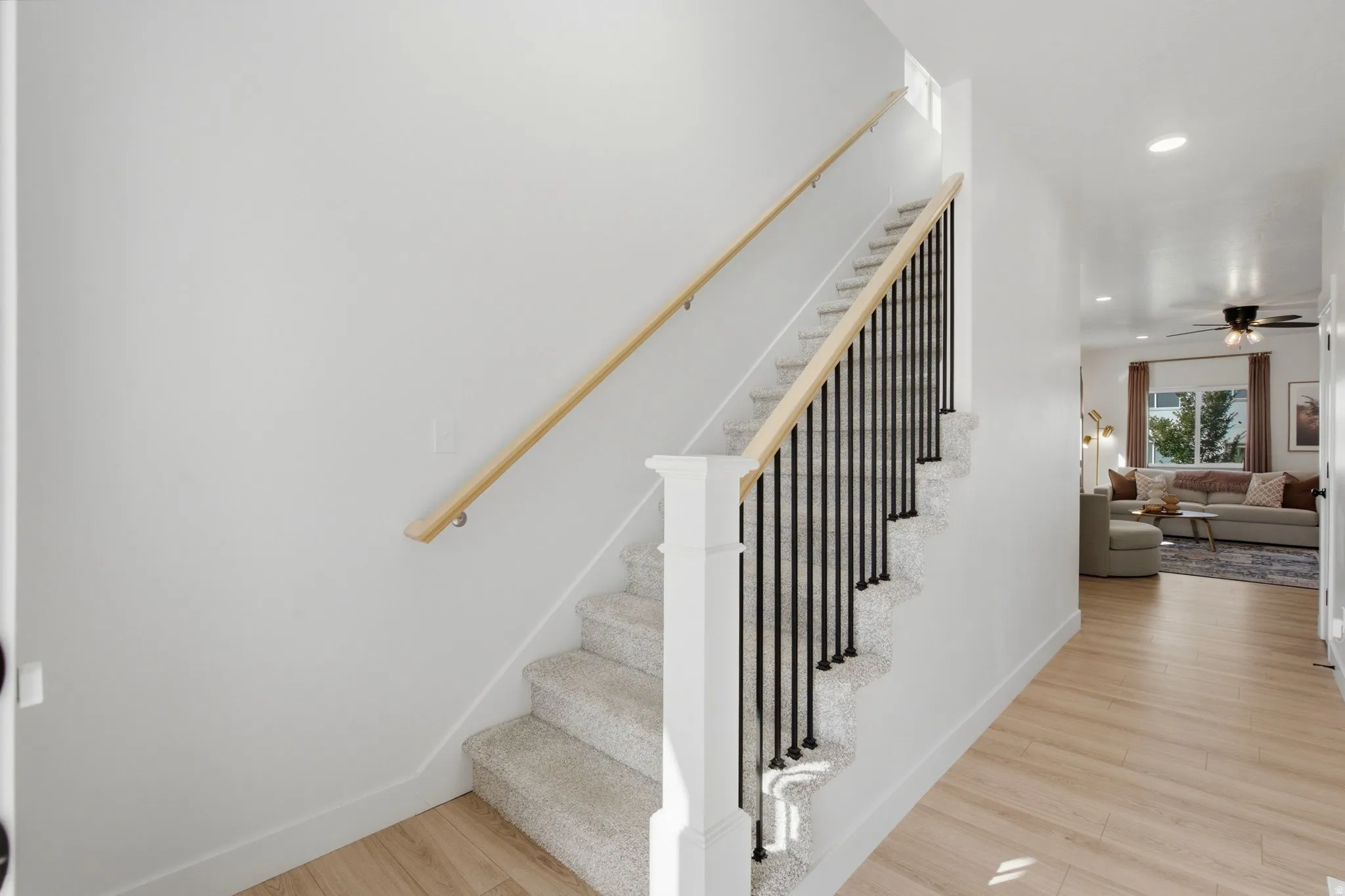 Inviting foyer and staircase with open railing