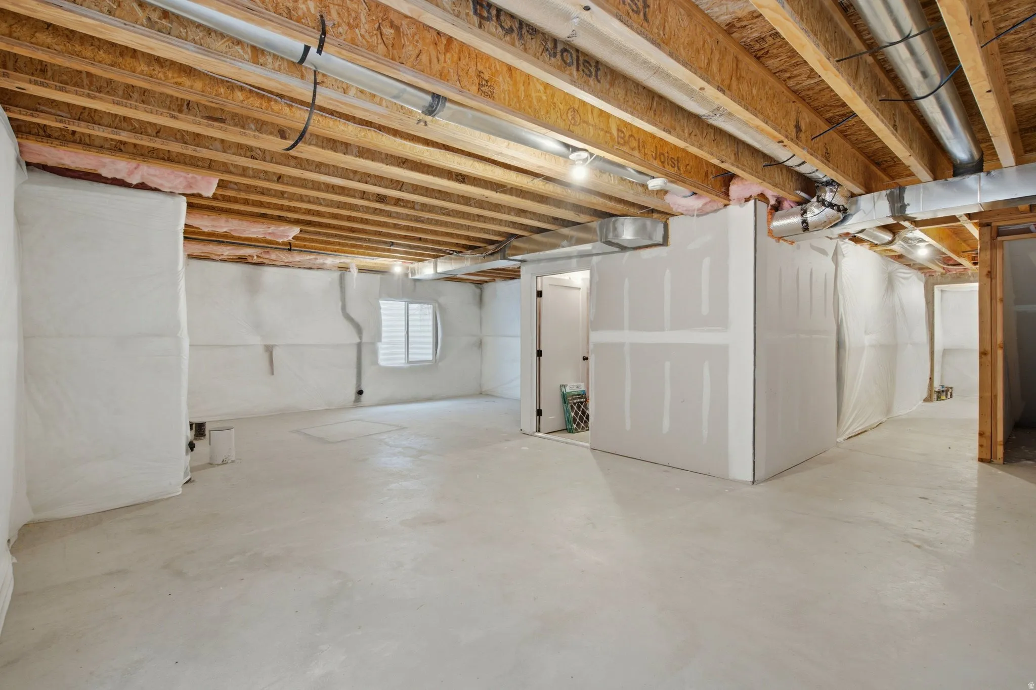 Unfinished basement featuring rough-in plumbing for a 4th bathroom