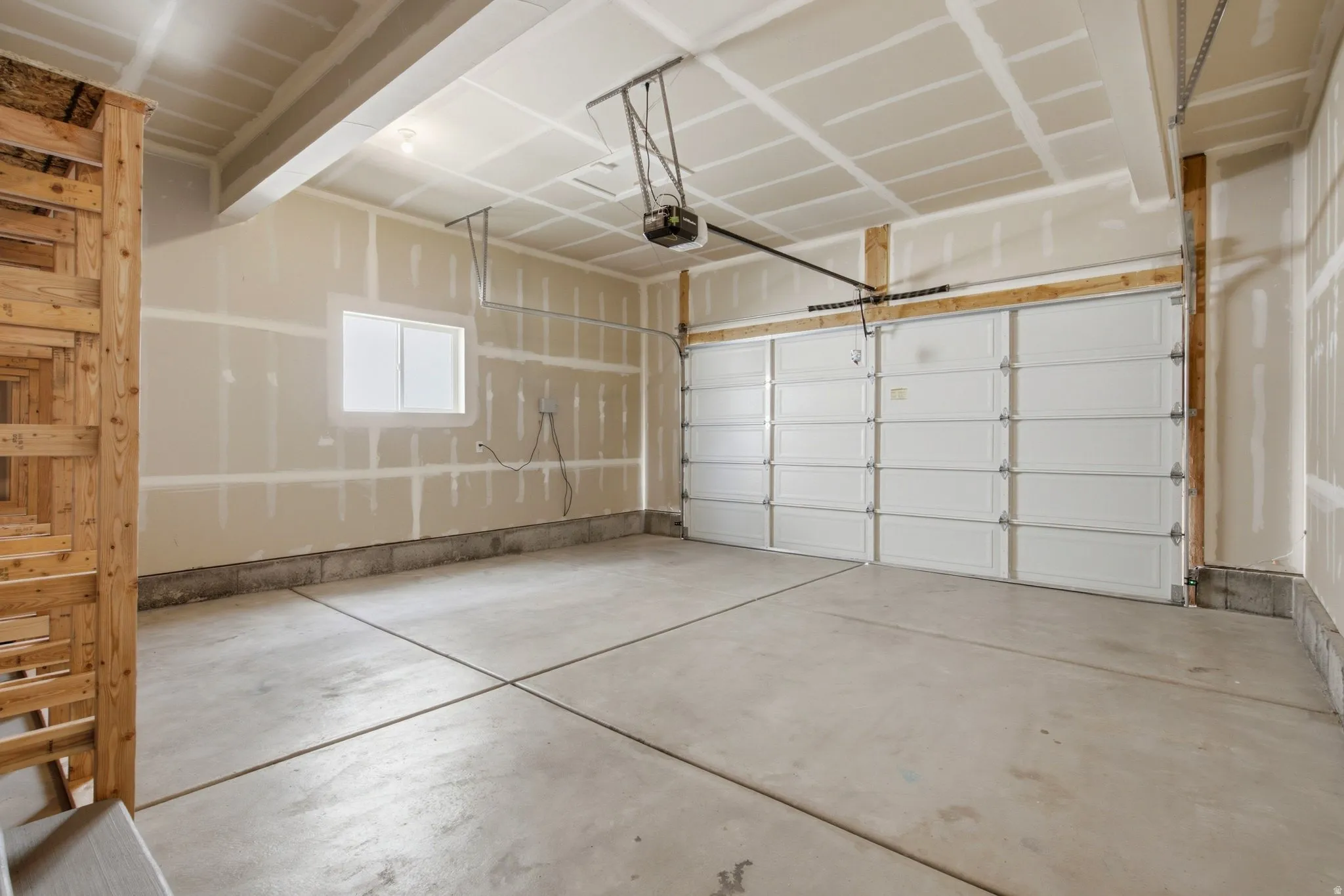 Attached garage featuring an app controlled automatic opener