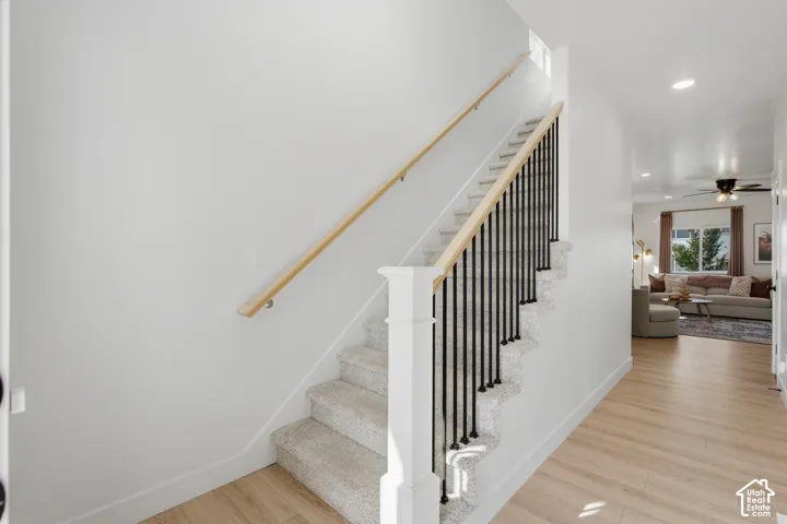 Inviting foyer and staircase with open railing