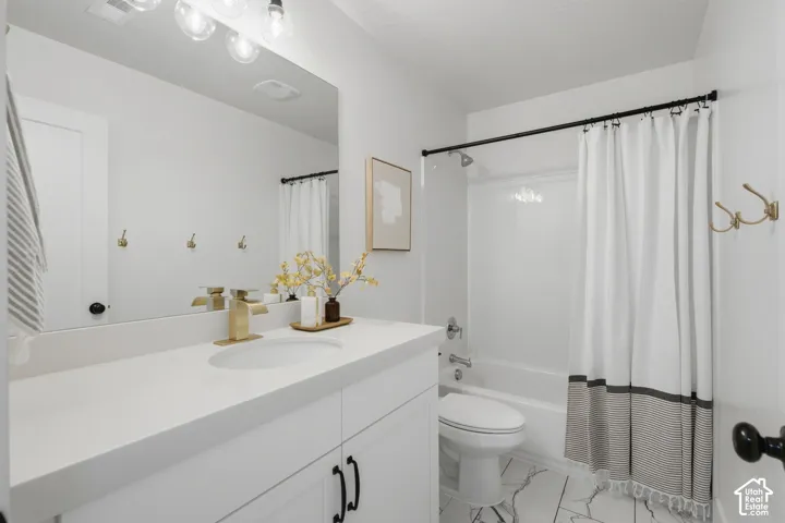 Full Bath with quartz countertops and upgraded plumbing and light fixtures