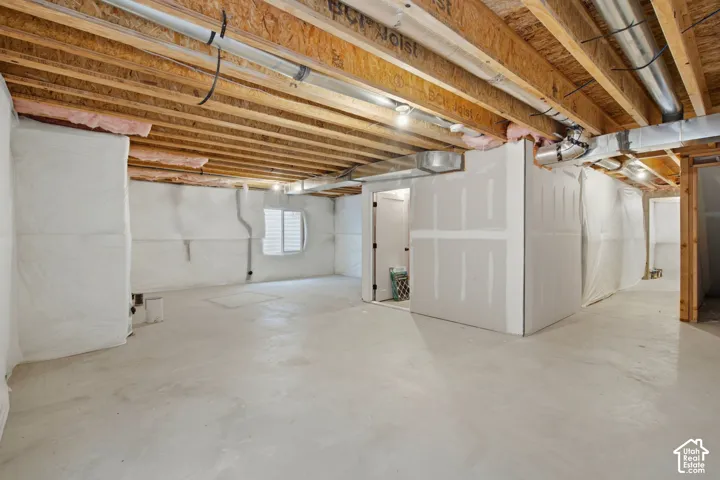 Unfinished basement featuring rough-in plumbing for a 4th bathroom
