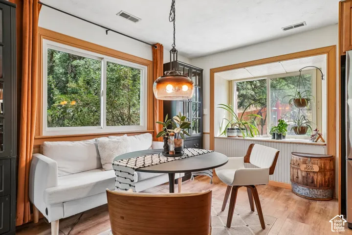 Wood-finish flooring with a decorative area rug
