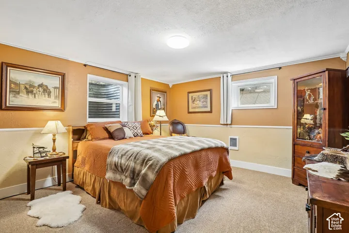 Carpeted flooring, white trim, two-tone wall paint, and recessed lighting