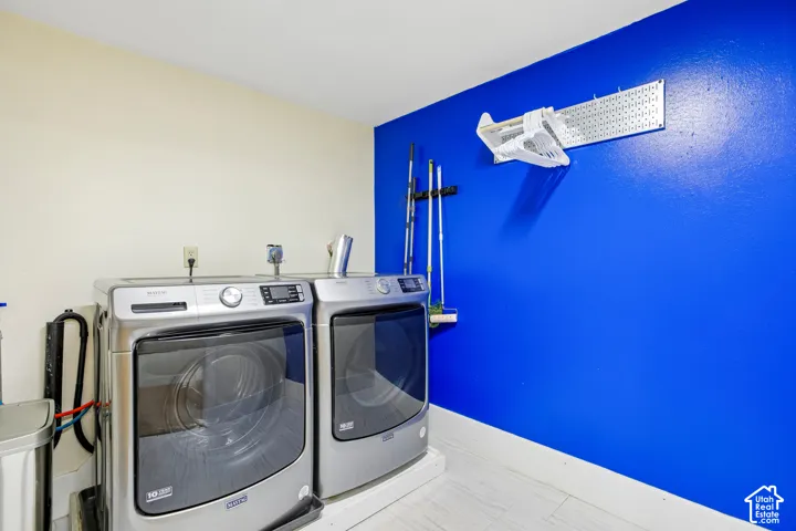 White-finish flooring with a contrasting blue accent wall
