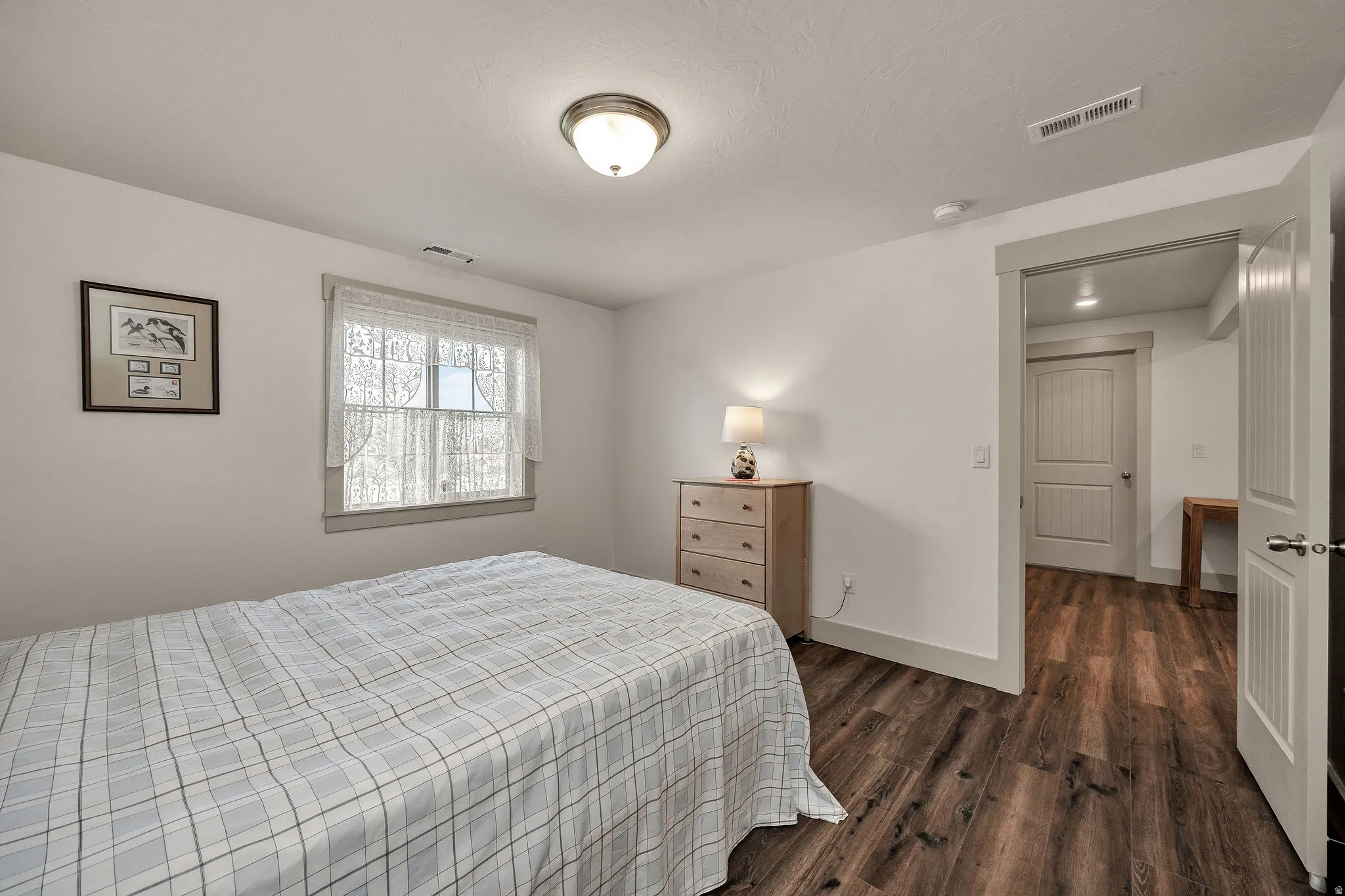 White walls with wood-finish flooring