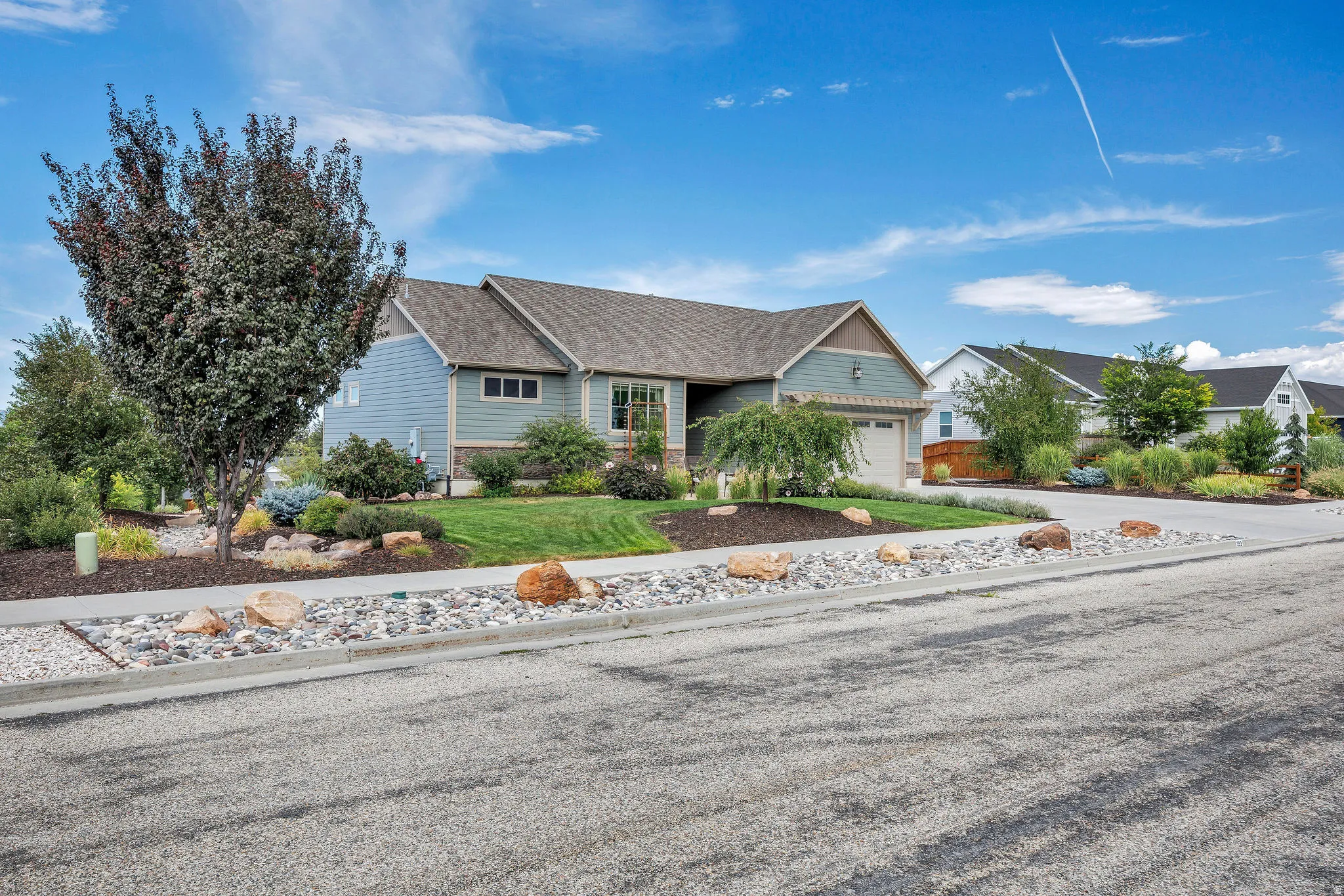 Ranch-style residence featuring a prominent front-facing garage