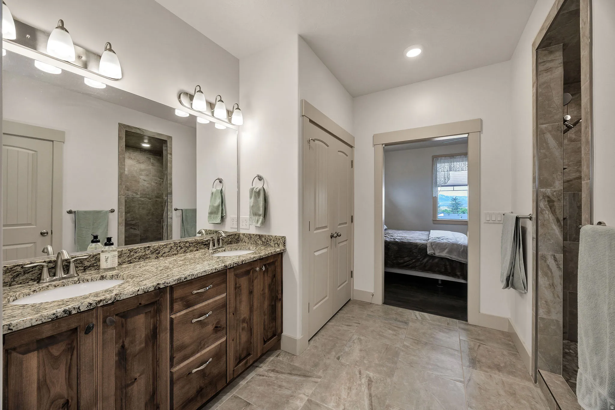 Dual vanity with granite countertop and undermount sinks